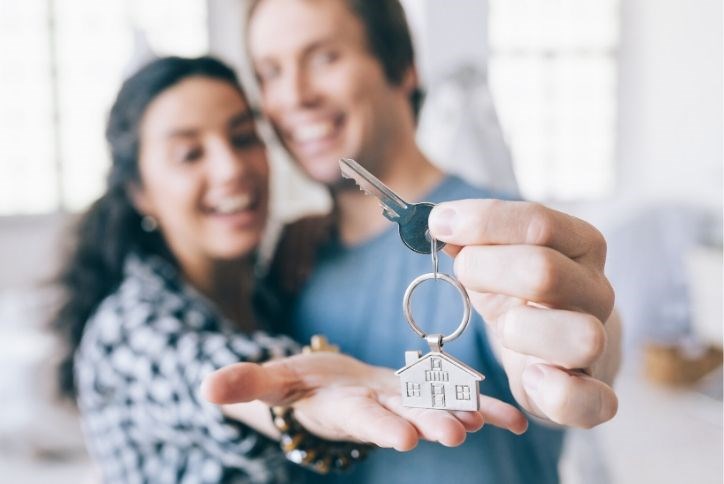 Couple getting keys to their new home